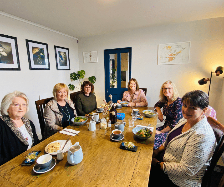 Women in conversation over coffee at an Empowerment Project networking meetup in Canterbury