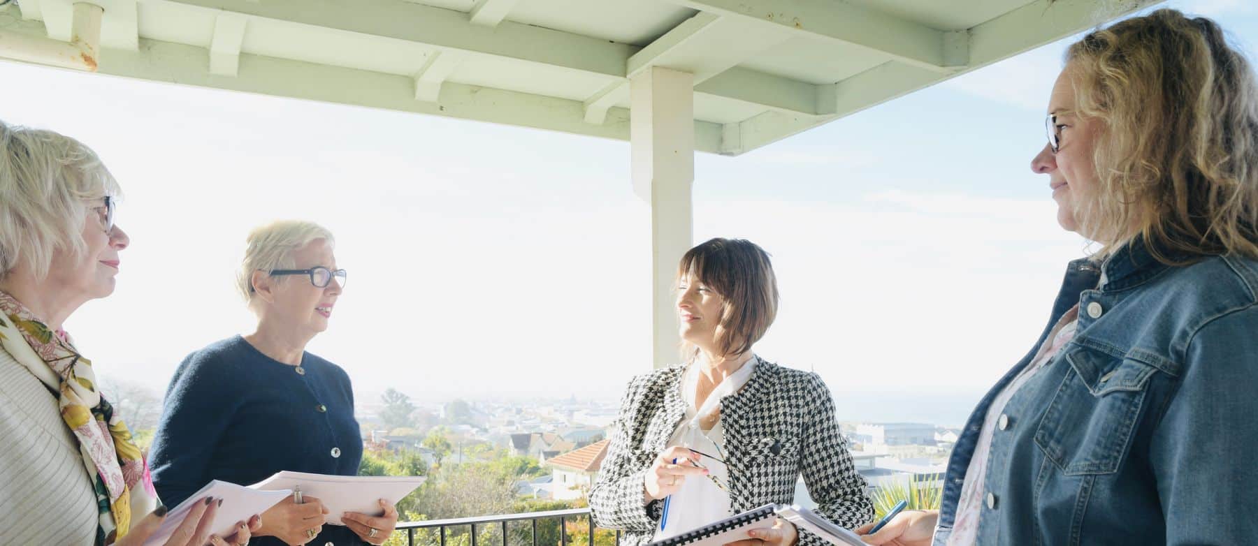 Women with notebooks at a Rise & Align retreat overlooking Christchurch
